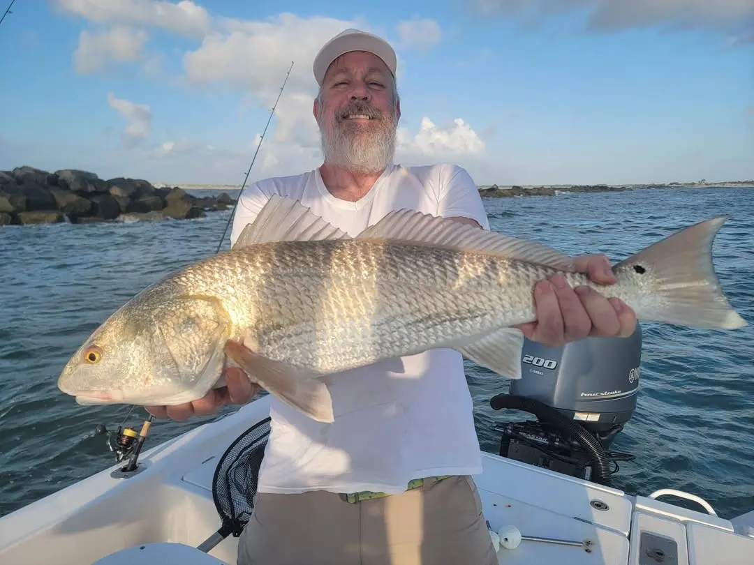 Angler with a redfish caught near New Smyrna Beach