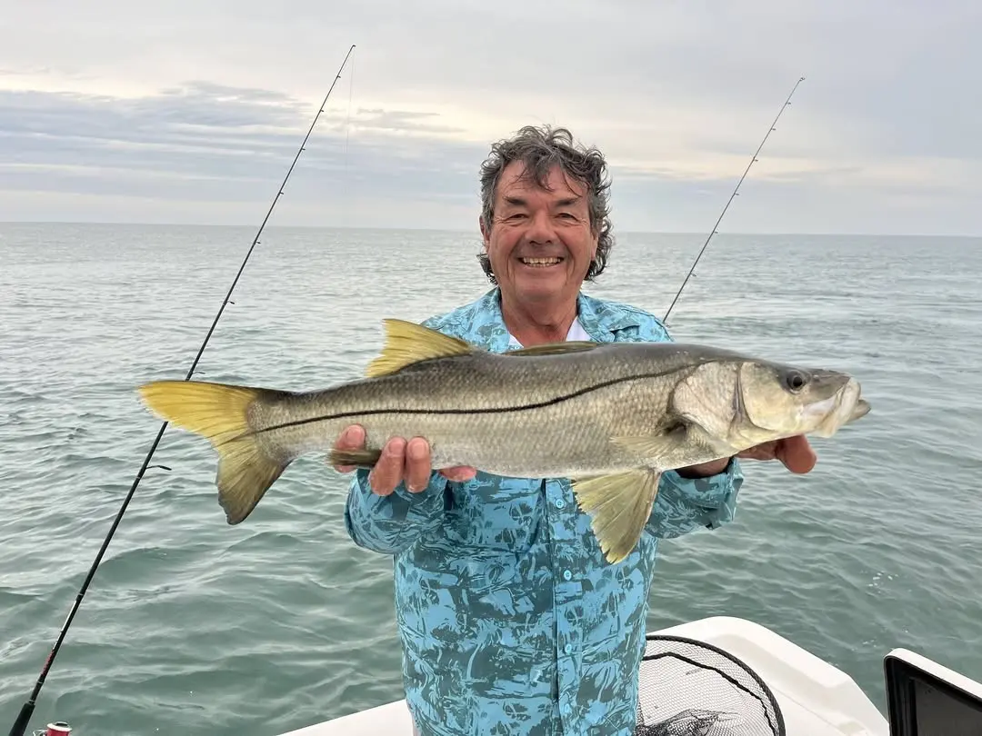 Captain Fred holding a snook