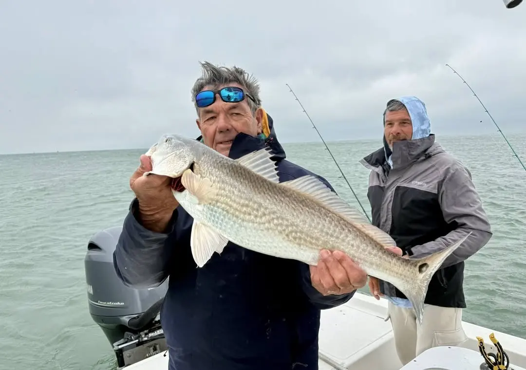 Captain Fred with a redfish on the flats