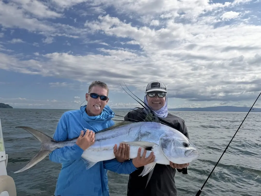 Two anglers with a jack crevalle
