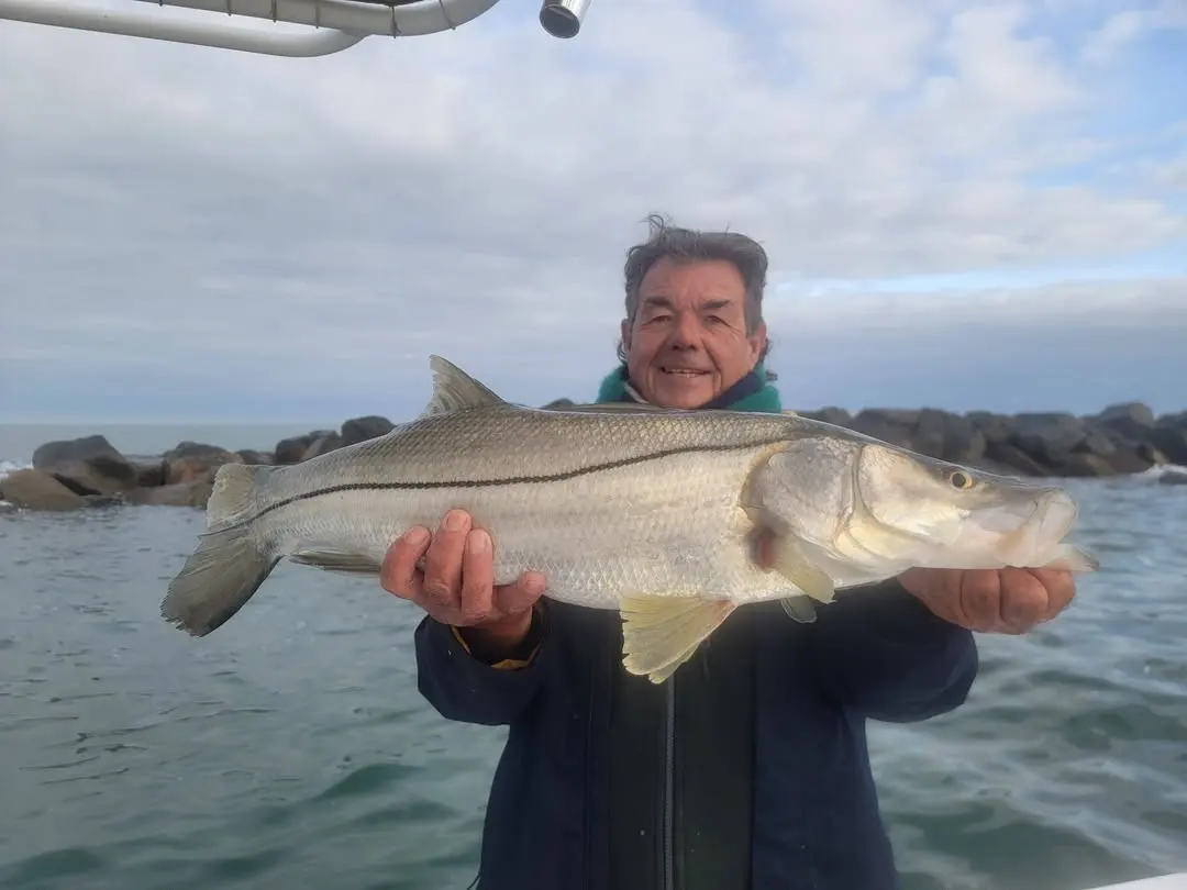 Captain Fred holding a snook