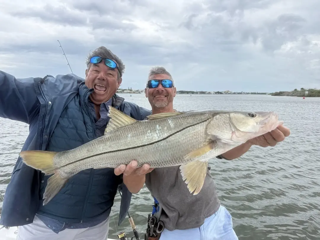 Two anglers with a snook