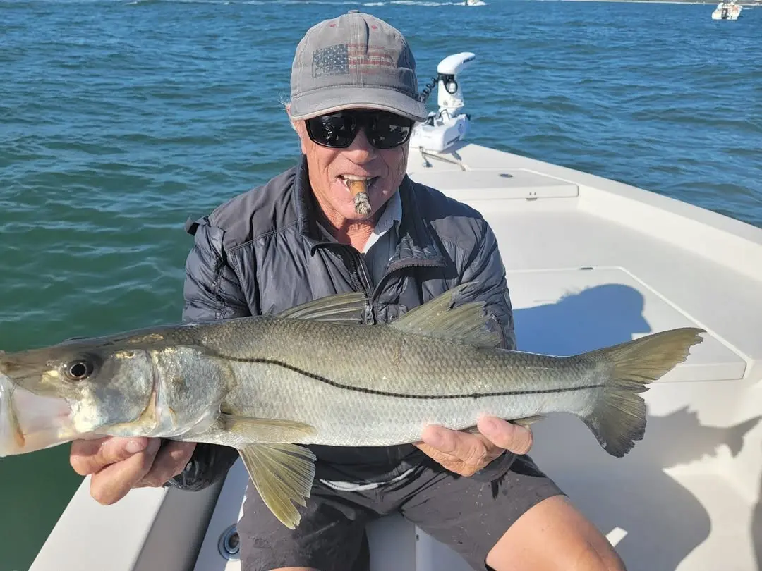 Angler with a snook