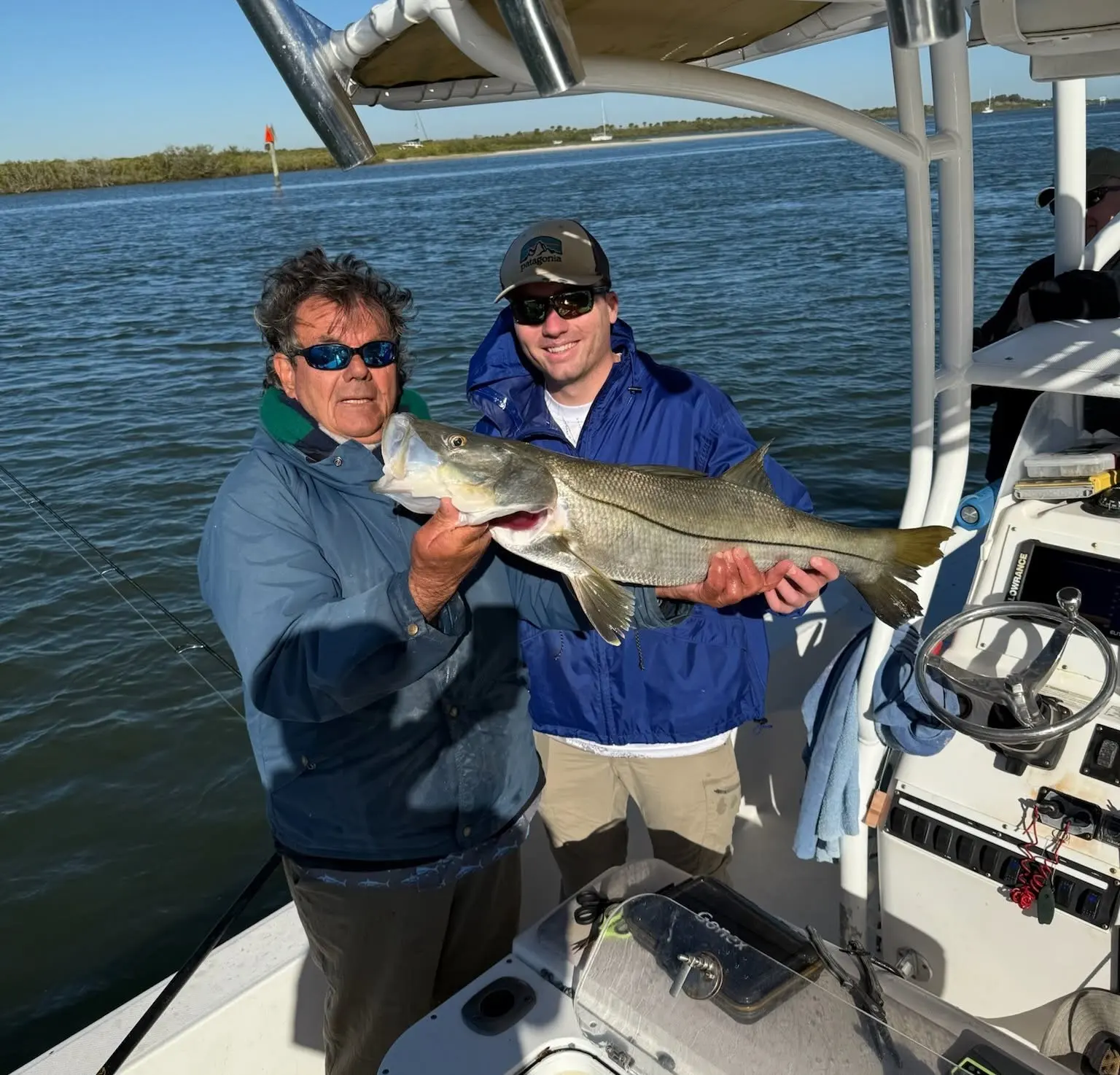 Captain Fred and a guest with a snook