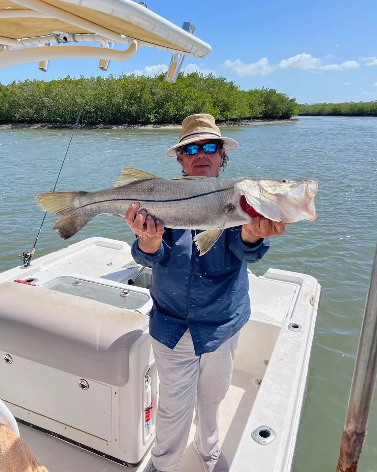 Angler with a redfish in Mosquito Lagoon