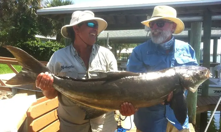 Captain Fred and a guest with a cobia